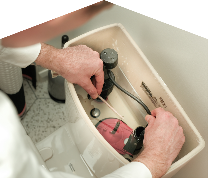 Francis plumbing specialist adjusts internal components of a toilet tank, with tile flooring visible in the background. Francis plumbing specialist adjusts internal components of a toilet tank, with tile flooring visible in the background.